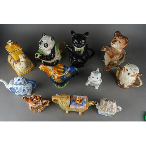 67 - A collection of novelty teapots including Black Cat, Camel, Panda, Dog, Owl, Cats, various factories... 