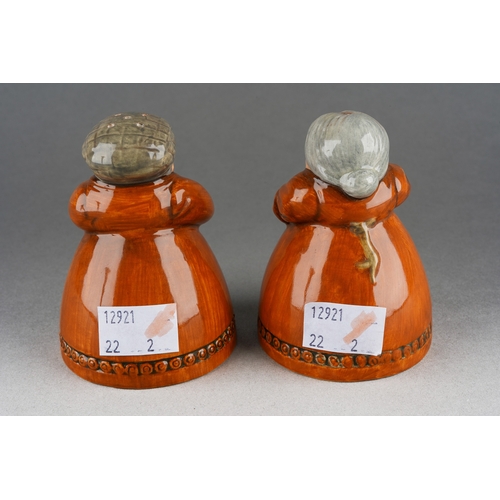 68 - A pair of Royal Doulton condiments including Toil for Men peppe and a Votes for Women salt, factory ... 