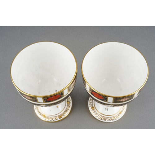 70 - A pair of Royal Crown Derby Imari 1128 goblets, red backstamps [2]