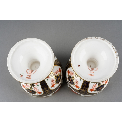 70 - A pair of Royal Crown Derby Imari 1128 goblets, red backstamps [2]