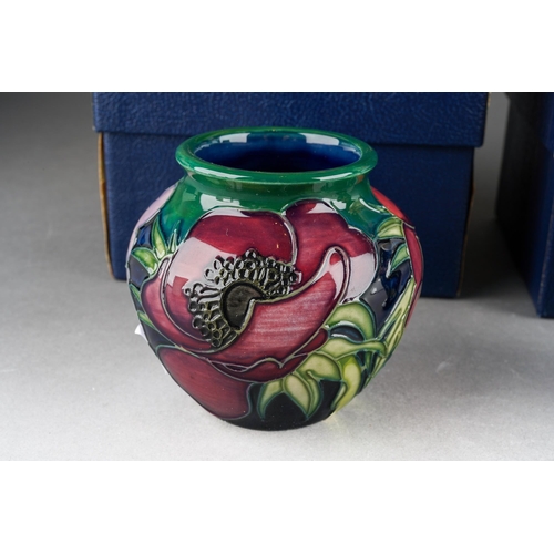 73 - Four Moorcroft small vases to include: 
1. Violet, 46/4, printed and painted marks, approx 10cm, box... 