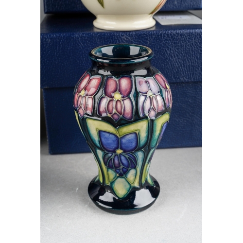 73 - Four Moorcroft small vases to include: 
1. Violet, 46/4, printed and painted marks, approx 10cm, box... 