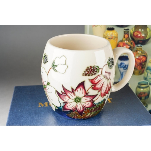 74 - A collection of Moorcroft to include: Bramble mug, 2012 date cypher, printed and painted marks, boxe... 