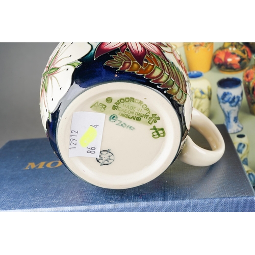 74 - A collection of Moorcroft to include: Bramble mug, 2012 date cypher, printed and painted marks, boxe... 