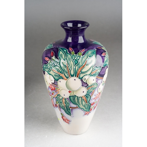 81 - A Moorcroft Snowberry [72/6] vase, designed by Nicola Slaney, 2003 date cypher, printed and painted ... 