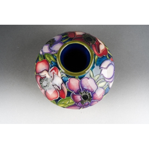 101 - A Moorcroft Anemone squat vase, 2003 date cypher, printed and painted marks, approx 11cm tall, boxed... 