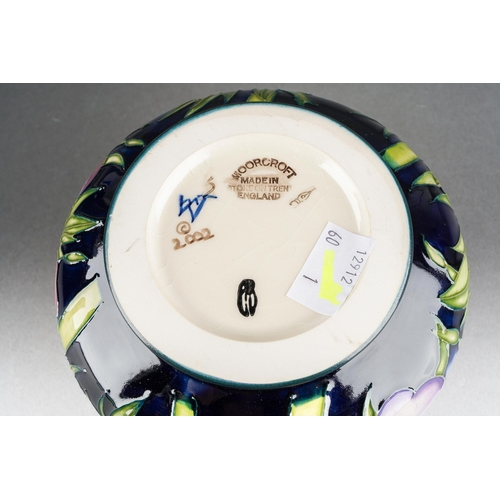 101 - A Moorcroft Anemone squat vase, 2003 date cypher, printed and painted marks, approx 11cm tall, boxed... 