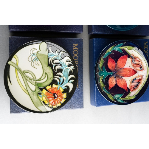 103 - Six boxed Moorcroft coasters or pin dishes, all with printed and painted marks, approx 12cm diam, to... 