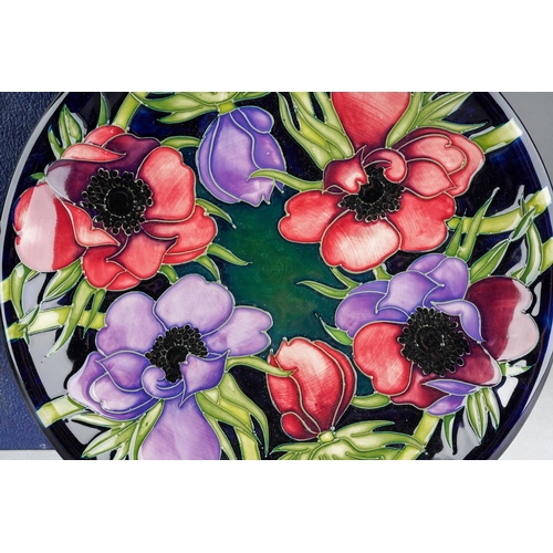 105 - A Moorcroft Anemone Tribute plate, cobalt blue ground, released 2002, printed and painted marks, app... 