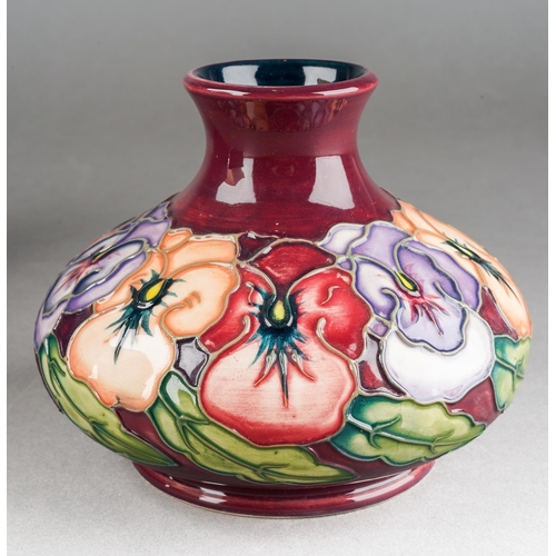 152 - A Moorcroft Pansy squat vase on maroon ground, 1998 date cypher, initials WM verso, approx 10cm tall... 