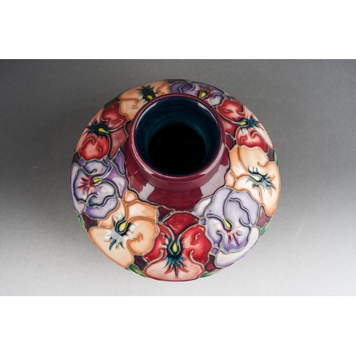 152 - A Moorcroft Pansy squat vase on maroon ground, 1998 date cypher, initials WM verso, approx 10cm tall... 
