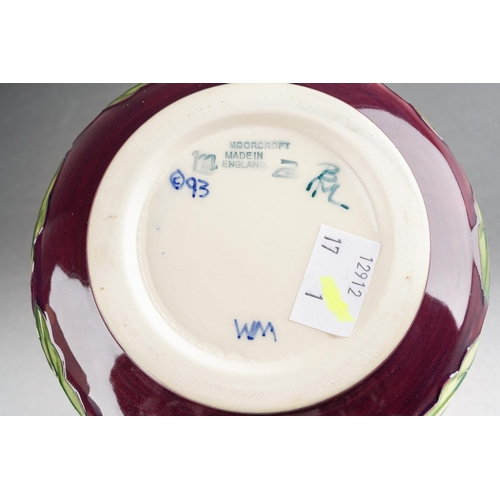 152 - A Moorcroft Pansy squat vase on maroon ground, 1998 date cypher, initials WM verso, approx 10cm tall... 