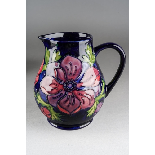 154 - A Moorcroft Anemone jug on cobalt blue ground, impressed mark, WM initials, 34/94, approx 14.5cm tal... 