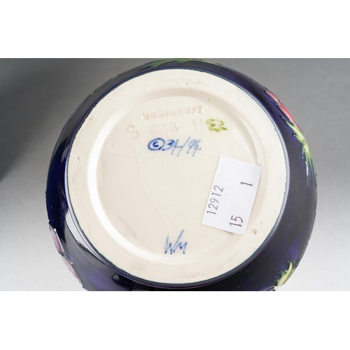 154 - A Moorcroft Anemone jug on cobalt blue ground, impressed mark, WM initials, 34/94, approx 14.5cm tal... 