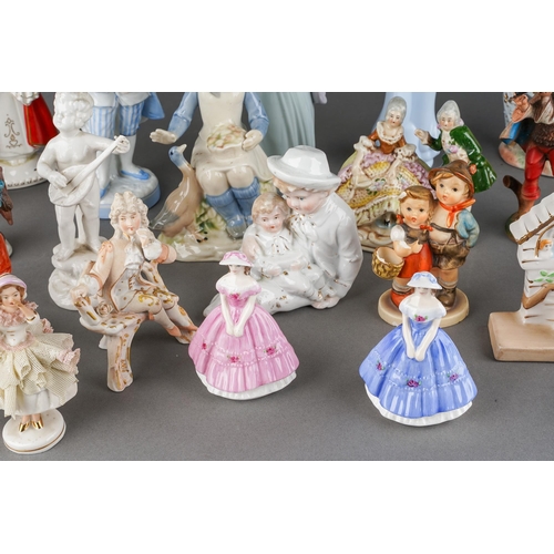189 - A collection of twenty Continental and English porcelain figures including Lladro Ingenue, Serenade ... 