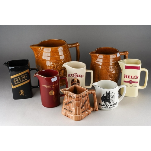 200 - A box of two Melling type pottery jugs & other assorted pub jugs, the larger Melling jug impressed 