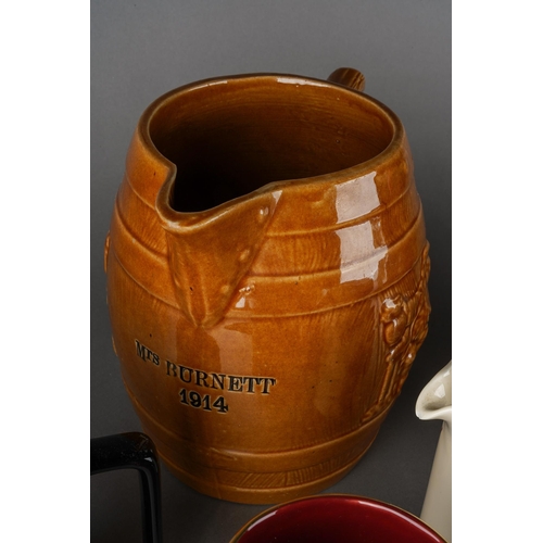 200 - A box of two Melling type pottery jugs & other assorted pub jugs, the larger Melling jug impressed 