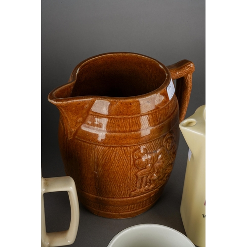 200 - A box of two Melling type pottery jugs & other assorted pub jugs, the larger Melling jug impressed 