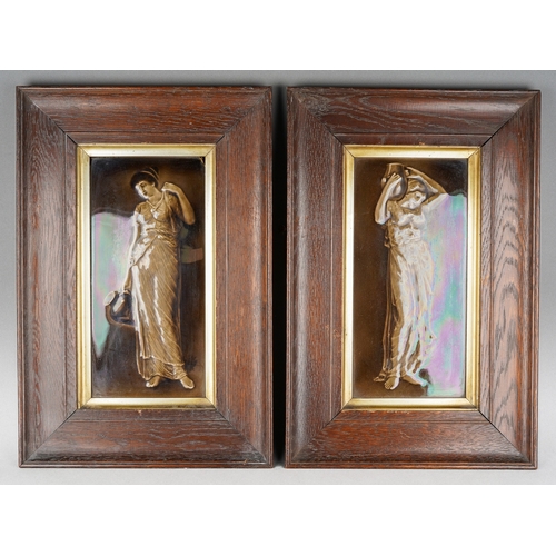 204 - A pair of late 19th century framed tiles of maidens, each frame measuring approximately 30cm by 46cm... 