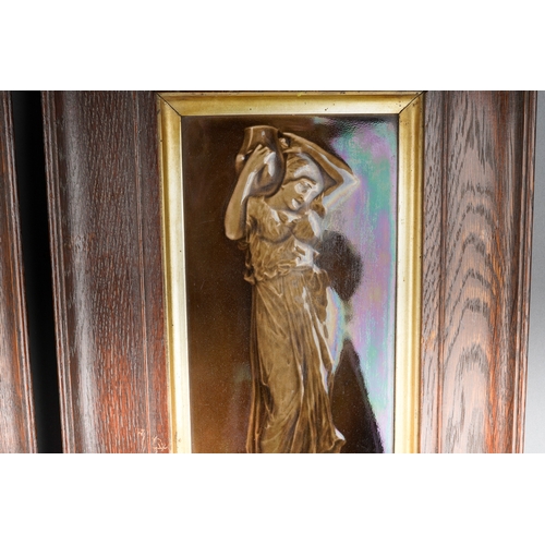 204 - A pair of late 19th century framed tiles of maidens, each frame measuring approximately 30cm by 46cm... 