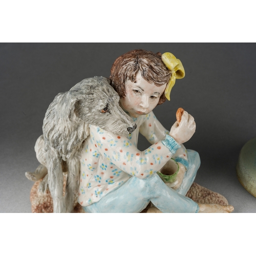 205 - A Modern glazed pottery model of a girl with her dog, signed Brenda Garner and a figure of a standin... 
