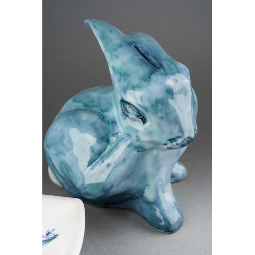 206 - A David Sharp pottery money box modelled as a blue rabbit, signed to underide and a Rye pottery shap... 