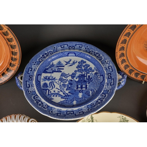 223 - A collection of 19th Century plates to include: 
Early Spode hot water plate printed with Willow pat... 