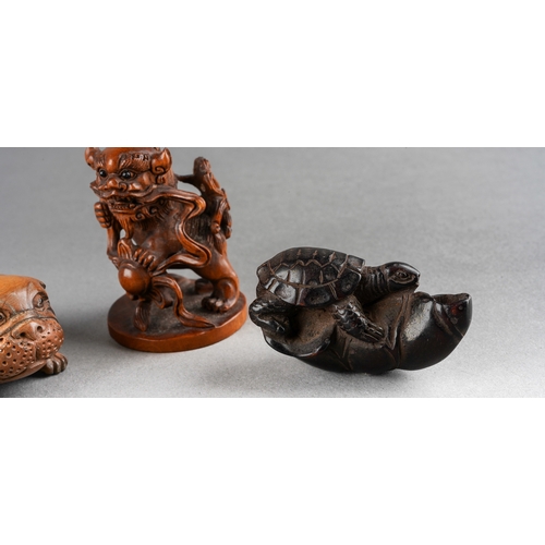 A collection of five Japanese Netsuke to include a rabbit, buffalo, dog ...