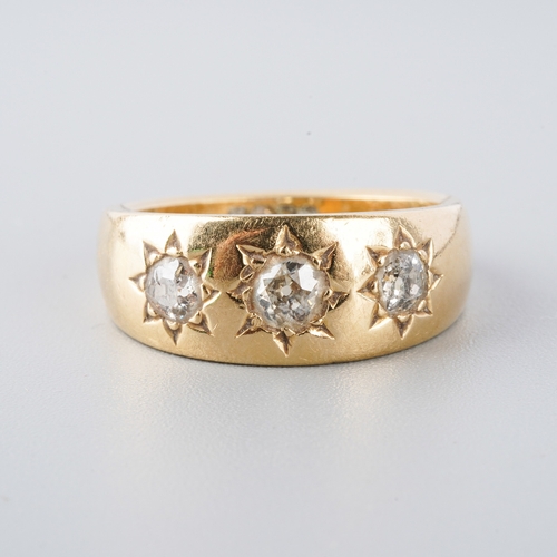 950 - An 18ct gold diamond three stone ring. Set with old cut diamonds, hallmarked 18ct gold, approx ring ... 