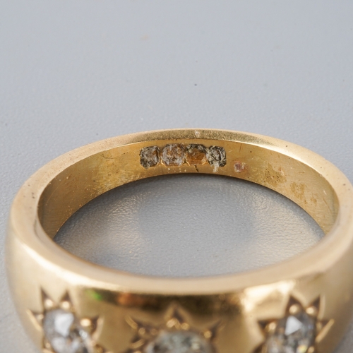 950 - An 18ct gold diamond three stone ring. Set with old cut diamonds, hallmarked 18ct gold, approx ring ... 