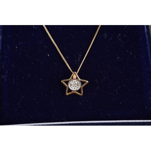 953 - Two diamond set yellow metal pendant wit chain. Pendants stamped 375 or 9ct, approx length pendants ... 