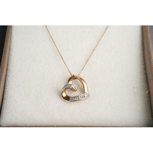 953 - Two diamond set yellow metal pendant wit chain. Pendants stamped 375 or 9ct, approx length pendants ... 