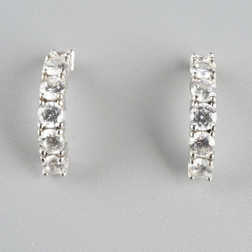 955 - A pair of white metal cubic zirconia earrings. Stamped 14k, approx gross weight 1.95grams.