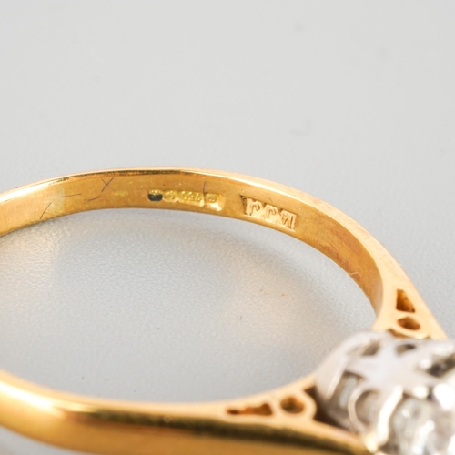 An 18ct gold diamond single stone ring. Set with a round brilliant cut ...