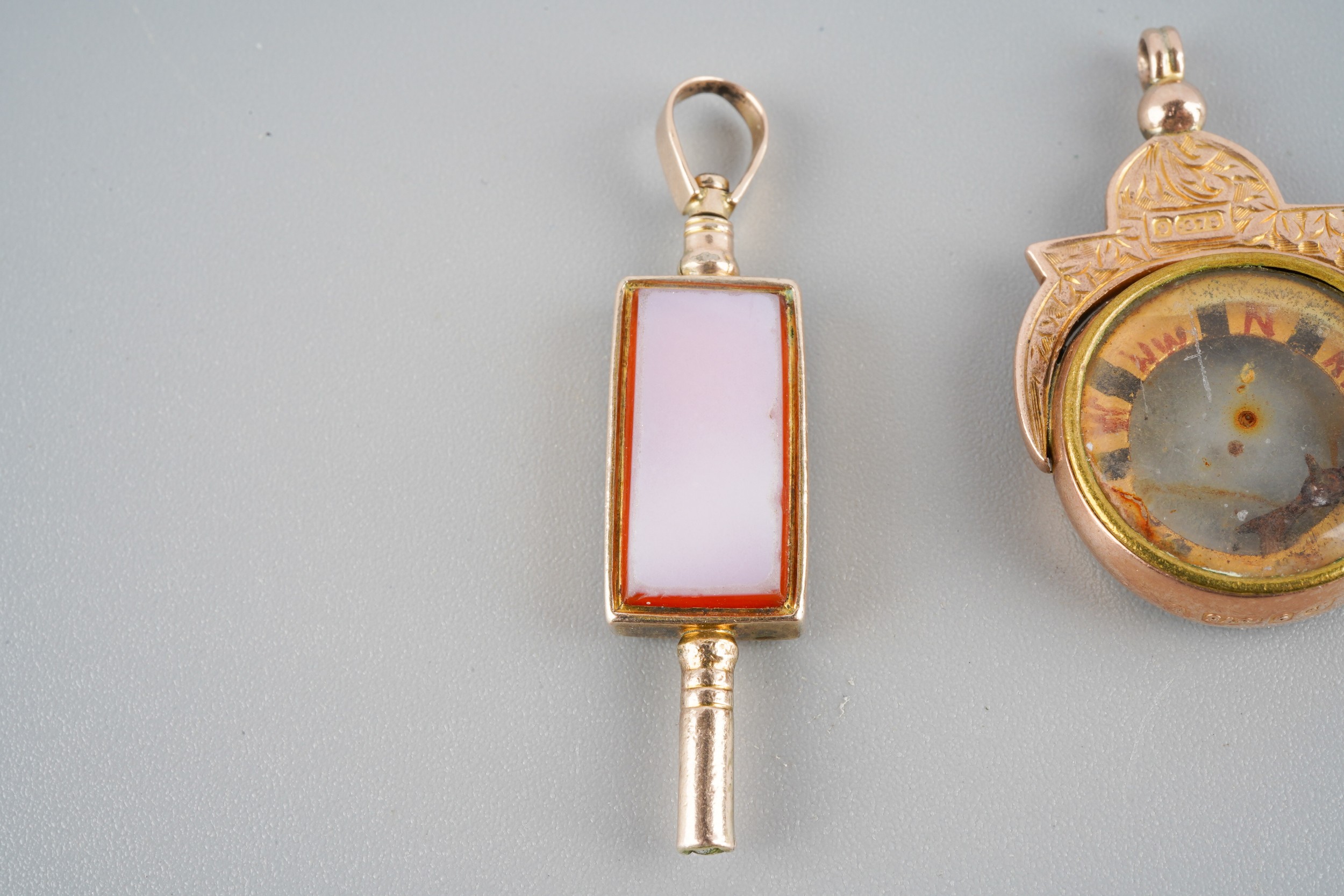 A collection of rolled gold and gold early 20th century charms. To ...