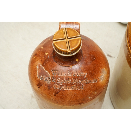 1 - A large stoneware storage flagon, the loop handle with thumb mark, approx 56cm tall and a smaller br... 