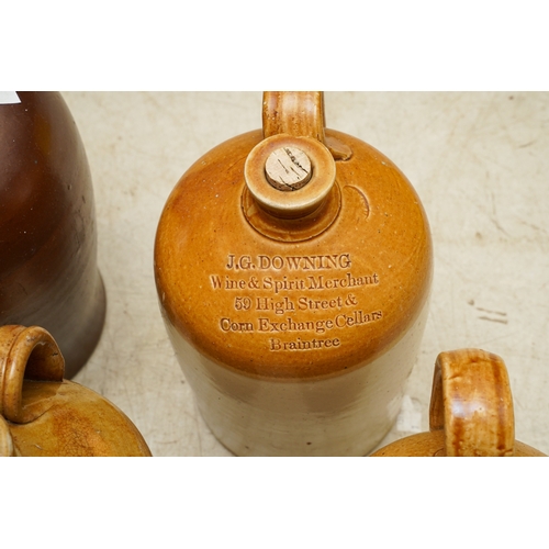 4 - Six Stoneware storage vessels / flagons, one unbranded burgundy glazed with loop handle with three t... 