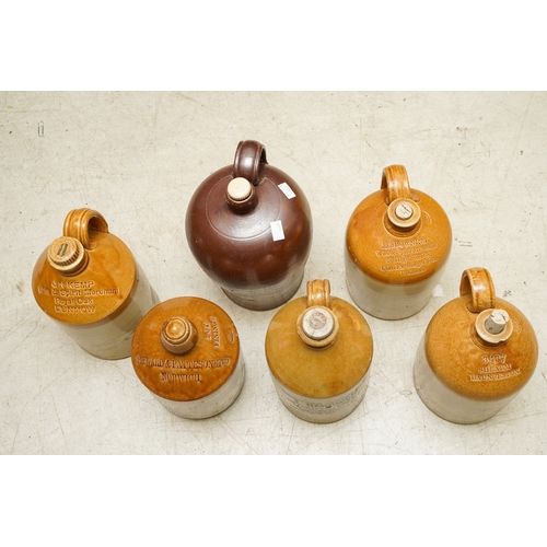 4 - Six Stoneware storage vessels / flagons, one unbranded burgundy glazed with loop handle with three t... 