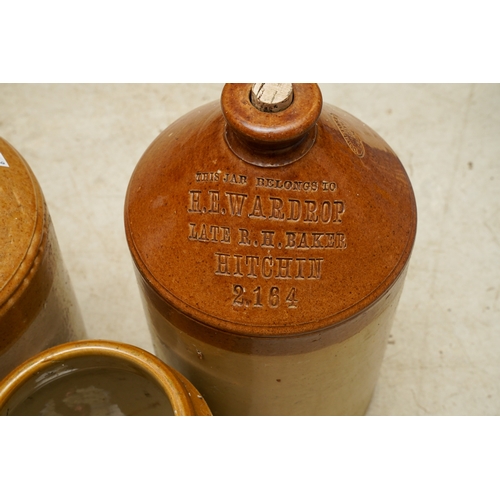 5 - Six Stoneware storage vessels / flagons, the jars unbranded, the three flagons with impressed brandi... 