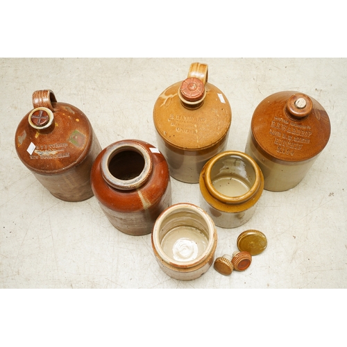 5 - Six Stoneware storage vessels / flagons, the jars unbranded, the three flagons with impressed brandi... 