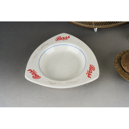 10 - Breweryana including Bass ashtrays, a Bass screw on casket top with wooden cork and a decorative cer... 
