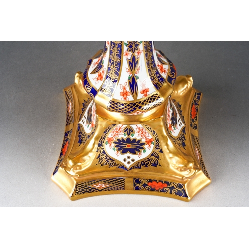 21 - A Royal Crown Derby Imari 1128 candlestick, 2nd quality, red backstamps, approx 26cm high [1] no app... 