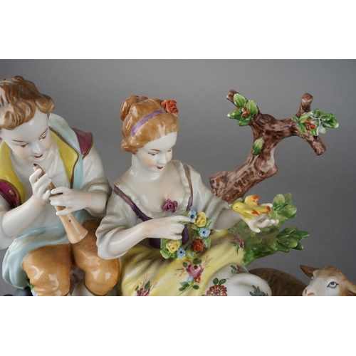 29 - A 20th century German Unterweissbach porcelain figure group of shepherd, shepherdess and sheep, prin... 