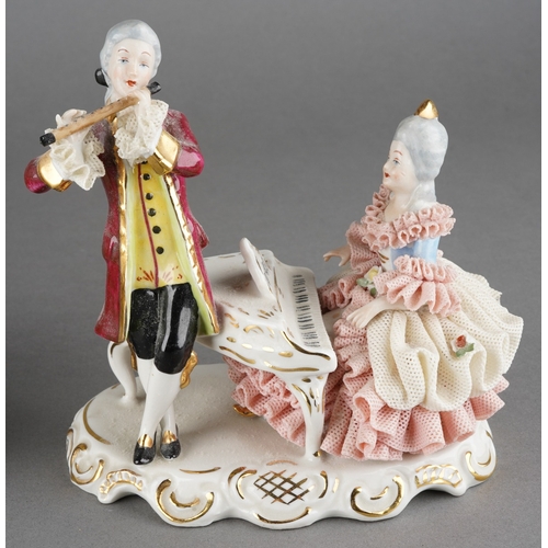 29 - A 20th century German Unterweissbach porcelain figure group of shepherd, shepherdess and sheep, prin... 
