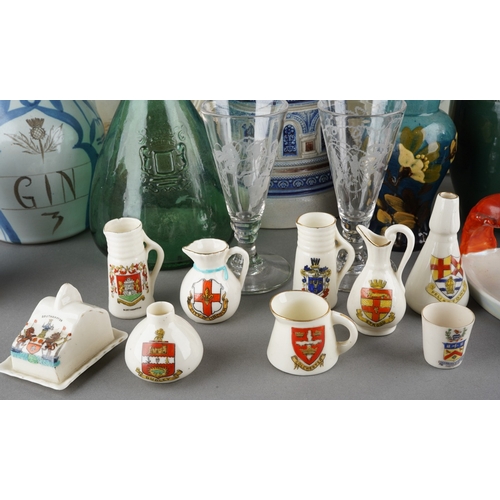 30 - A collection of pottery, porcelain and glass including a small Amphora vase decorated with a stork, ... 