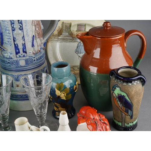 30 - A collection of pottery, porcelain and glass including a small Amphora vase decorated with a stork, ... 