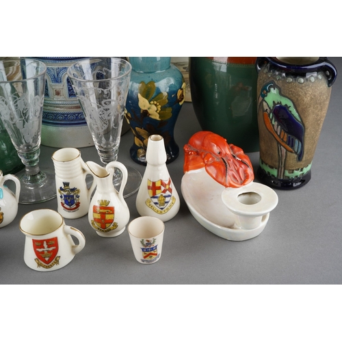 30 - A collection of pottery, porcelain and glass including a small Amphora vase decorated with a stork, ... 