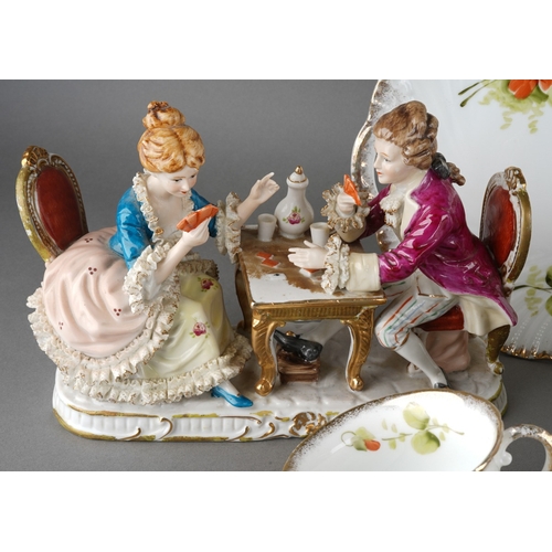 31 - A late 19th / early 20th century Continental porcelain tea set painted with pink and red flowers, co... 