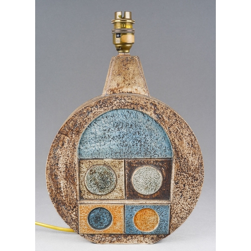 A Troika Wheel Lamp Base by Eleanor Winning, circa 1974/5, both sides incised geometric motifs in orange and blue on earthy tones, signed Troika Cornwall and Artist's Initials, approx 26cm high x 21.5cm wide, electrified but untested [1] overall condition good