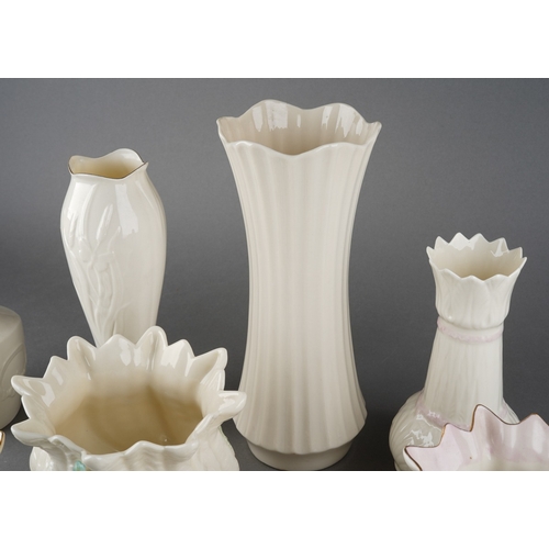 56 - A collection of late 20th Century Belleek comprising six vases and two jardinieres patterns include ... 
